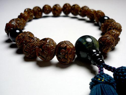 Men's prayer beads, peach pit, boat Arhat carving