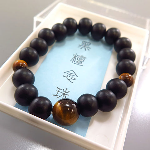 Striped ebony 10mm bead bracelet with tiger's eye