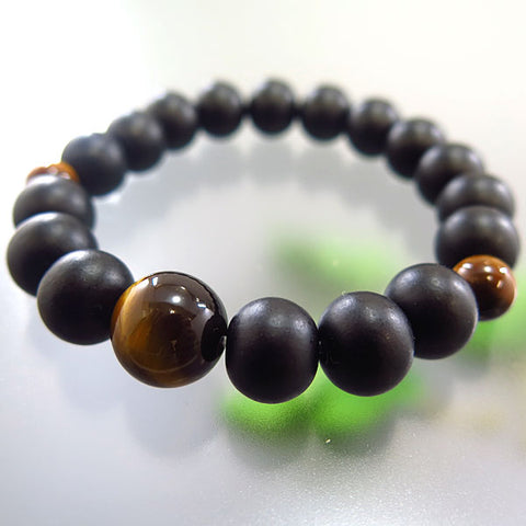 Striped ebony 10mm bead bracelet with tiger's eye
