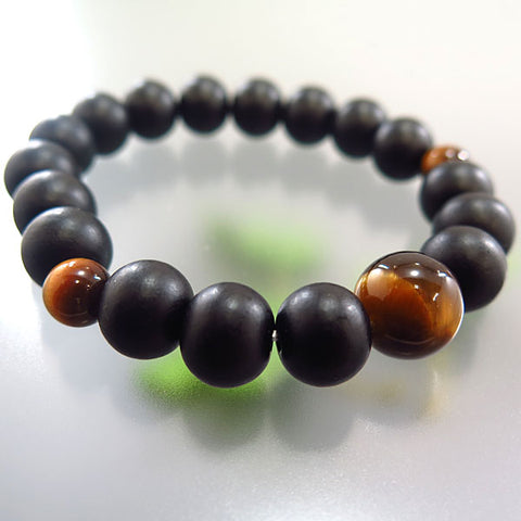 Striped ebony 10mm bead bracelet with tiger's eye