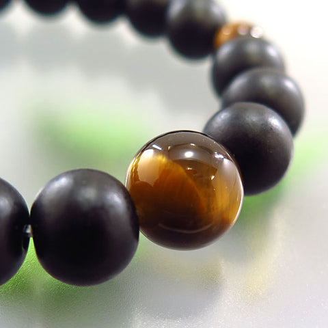 Striped ebony 10mm bead bracelet with tiger's eye