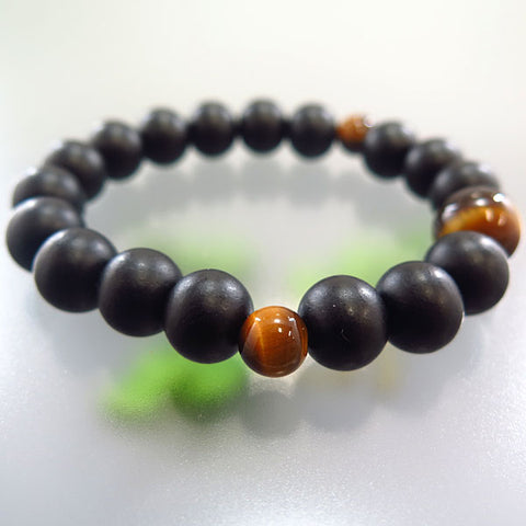 Striped ebony 10mm bead bracelet with tiger's eye