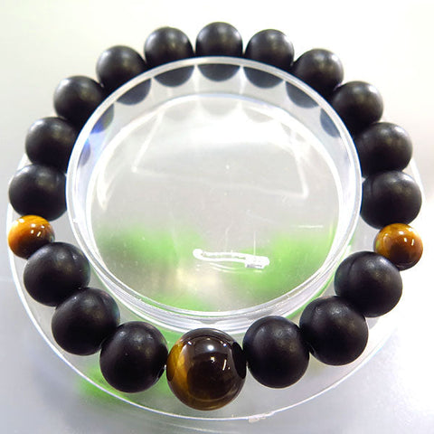 Striped ebony 10mm bead bracelet with tiger's eye