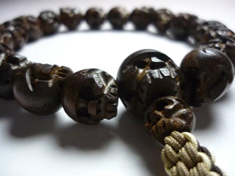Men's prayer beads, briar wood, skull carving