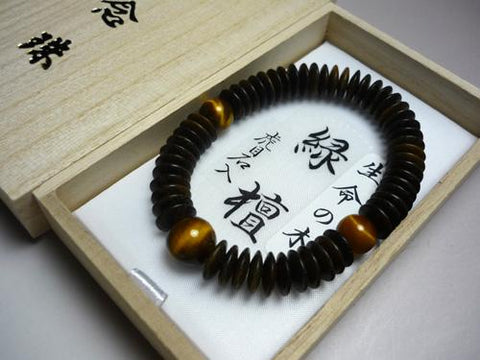 Green sandalwood bracelet with tiger's eye stone