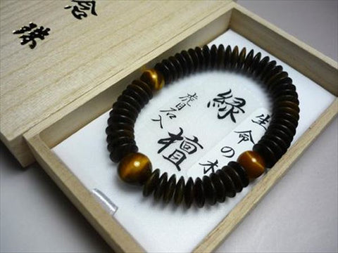 Green sandalwood bracelet with tiger's eye stone