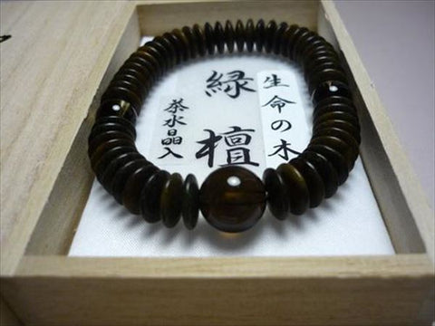 Green sandalwood bracelet with brown crystal