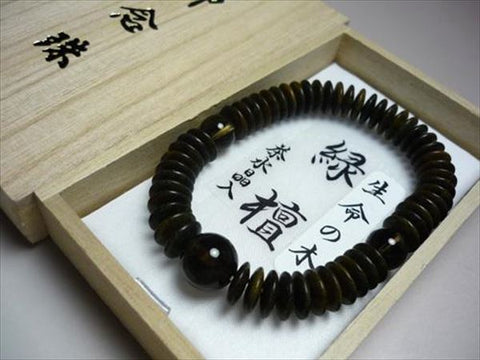 Green sandalwood bracelet with brown crystal