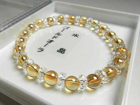 Gold aura 6mm bead bracelet with cut crystal