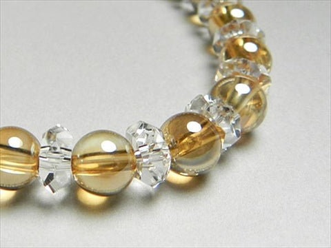 Gold aura 6mm bead bracelet with cut crystal