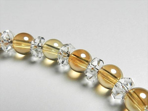 Gold aura 6mm bead bracelet with cut crystal