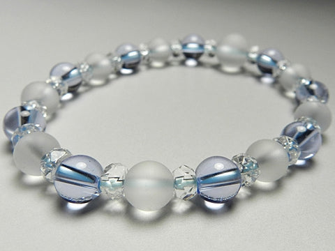 Crystal windowed light snow design bracelet with blue quartz combination