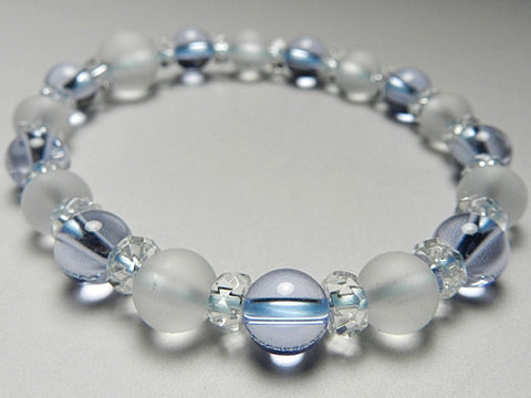 Crystal windowed light snow design bracelet with blue quartz combination