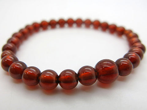 African Garnet 6mm Bead Bracelet 7106791000000 - worn on wrist
