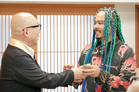 THE FRAGRANCE OF JAPANESE SPIRIT – Kento Mori receiving a flame from Tendai priest Gyokai Imadegawa of Enryakuji